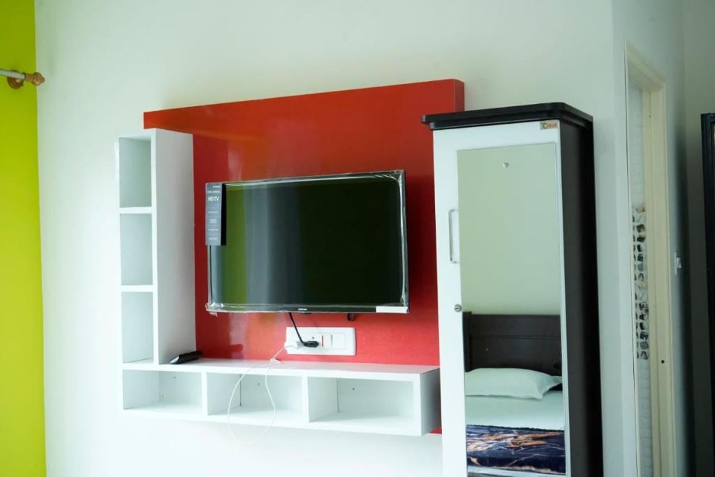 TV a/nebo společenská místnost v ubytování COORG PRINCE Home Stay