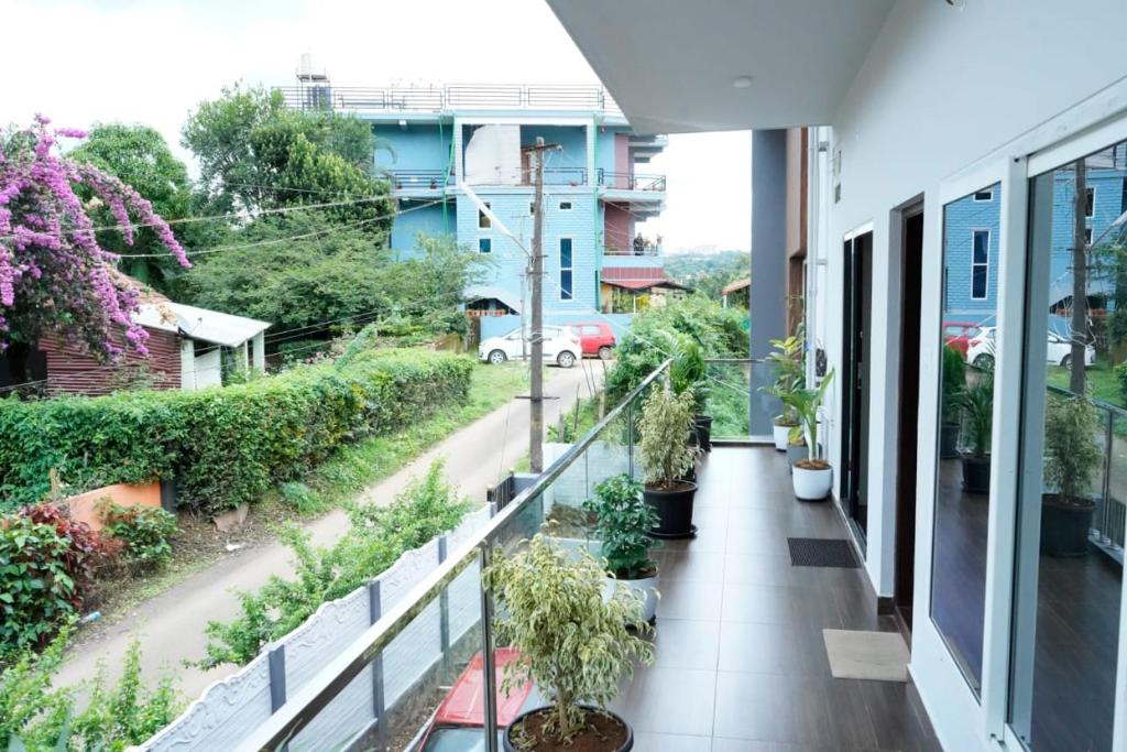 Balkón nebo terasa v ubytování COORG PRINCE Home Stay