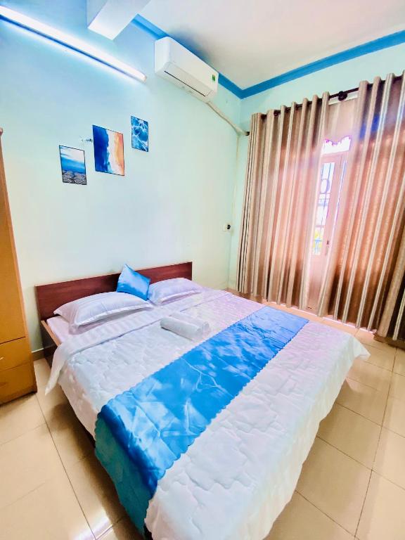 Postel nebo postele na pokoji v ubytování Phú Mỹ Port Motel