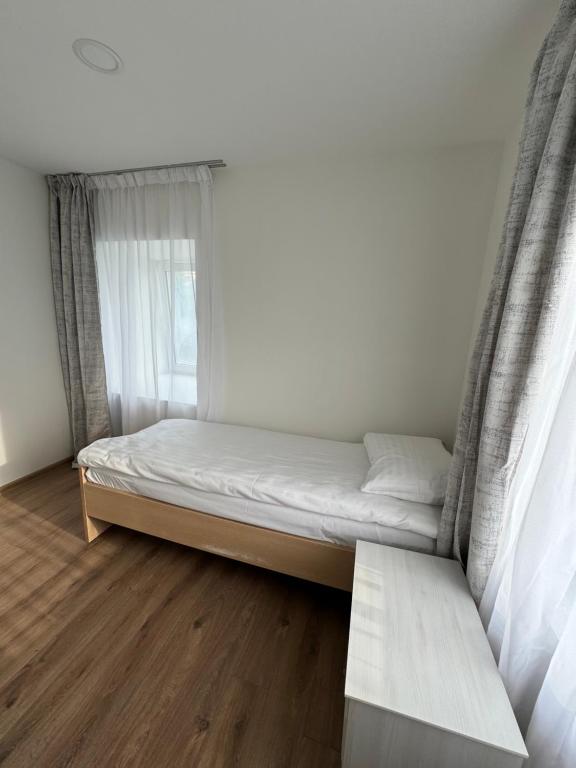 Postel nebo postele na pokoji v ubytování Žuvėdrų Namai Šventoji