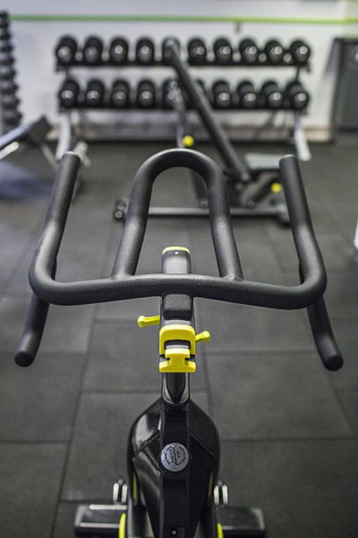 a close up of a bike seat in a gym at First Hotel Grand in Odense