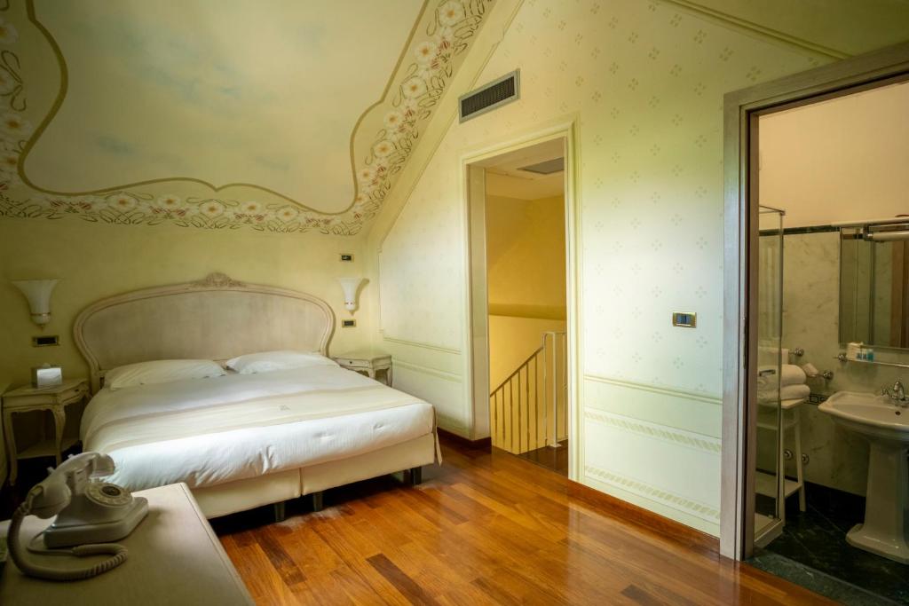 Postel nebo postele na pokoji v ubytování Suite Hotel Nettuno