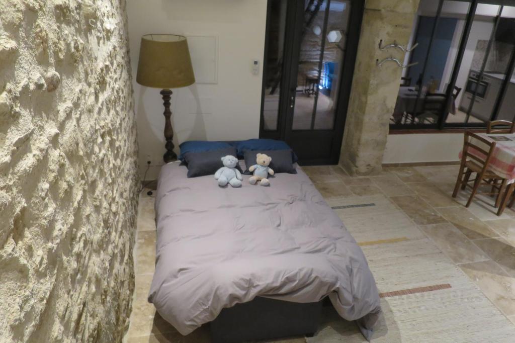 Postel nebo postele na pokoji v ubytování La grotte