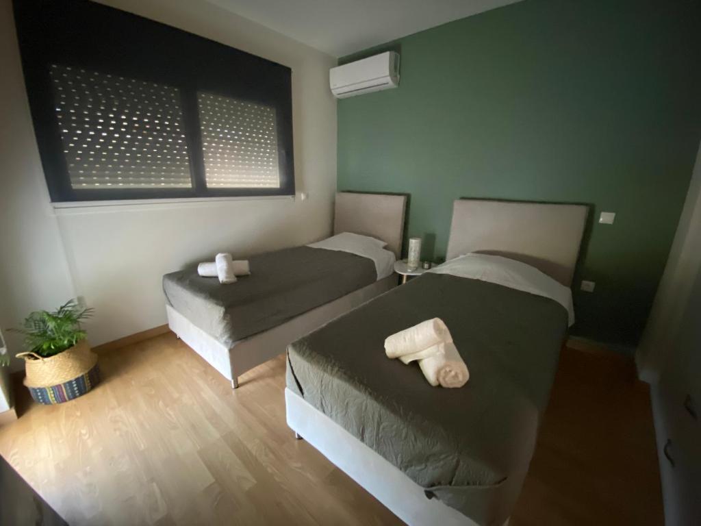 Postel nebo postele na pokoji v ubytování Selini apartment