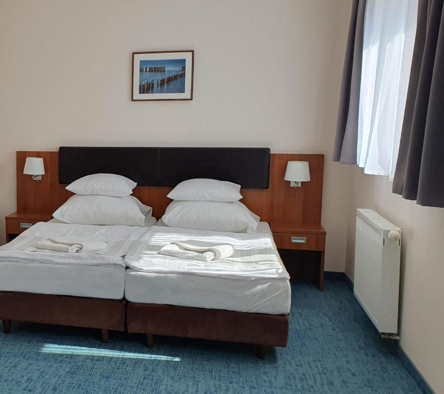 Postel nebo postele na pokoji v ubytování Maximus Spa