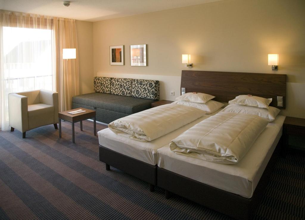 Postel nebo postele na pokoji v ubytování Hotel Gasthof Krönele