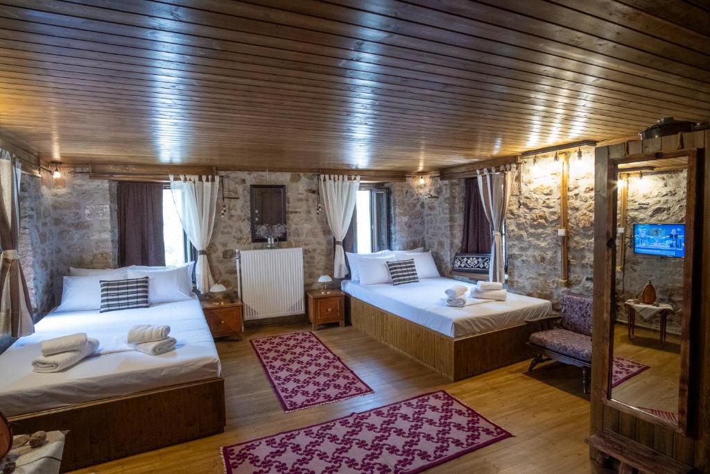 Postel nebo postele na pokoji v ubytování Kamara 1873 Sirrako