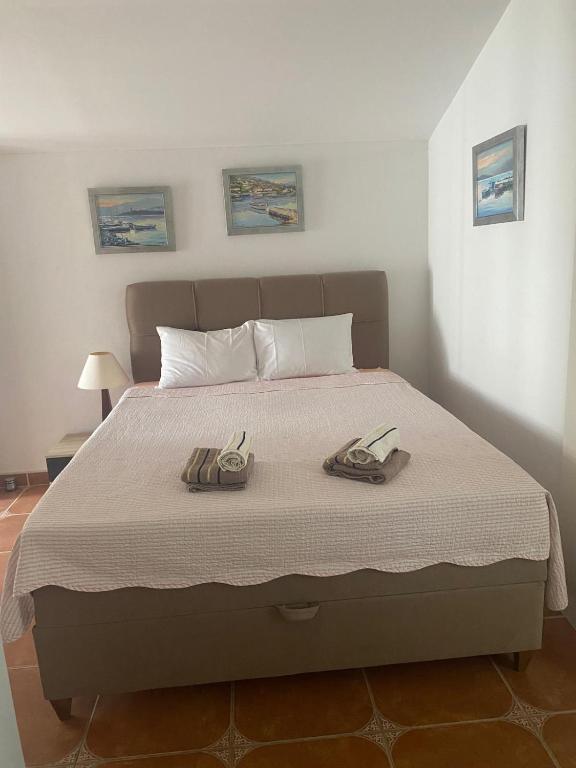 Postel nebo postele na pokoji v ubytování Studio Apartmani Kremić