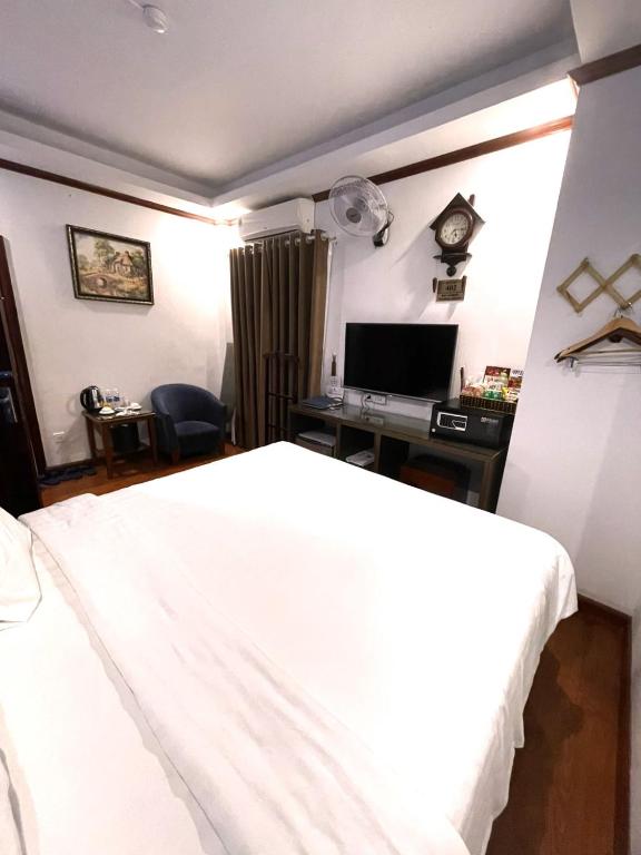 Postel nebo postele na pokoji v ubytování A25 Hotel - 57 Quang Trung