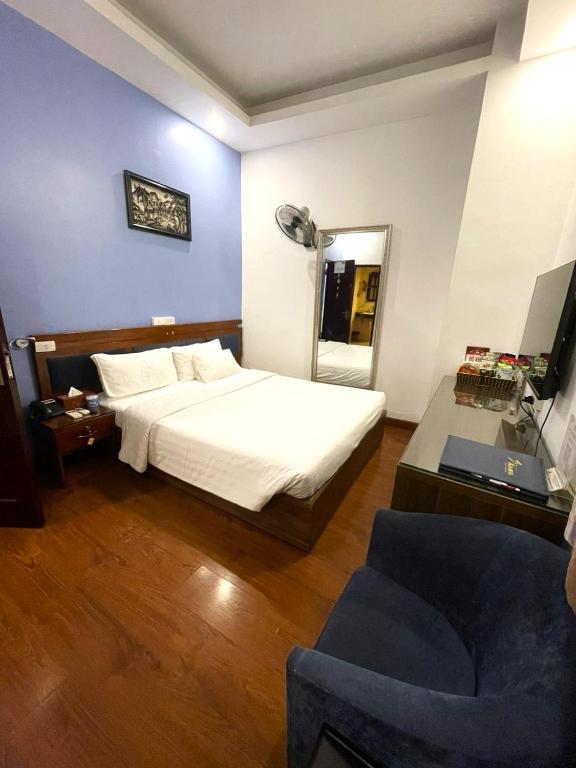 Postel nebo postele na pokoji v ubytování A25 Hotel - 57 Quang Trung