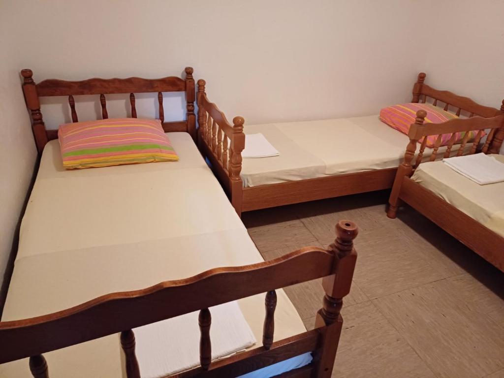 Postel nebo postele na pokoji v ubytování Apartmani Gina
