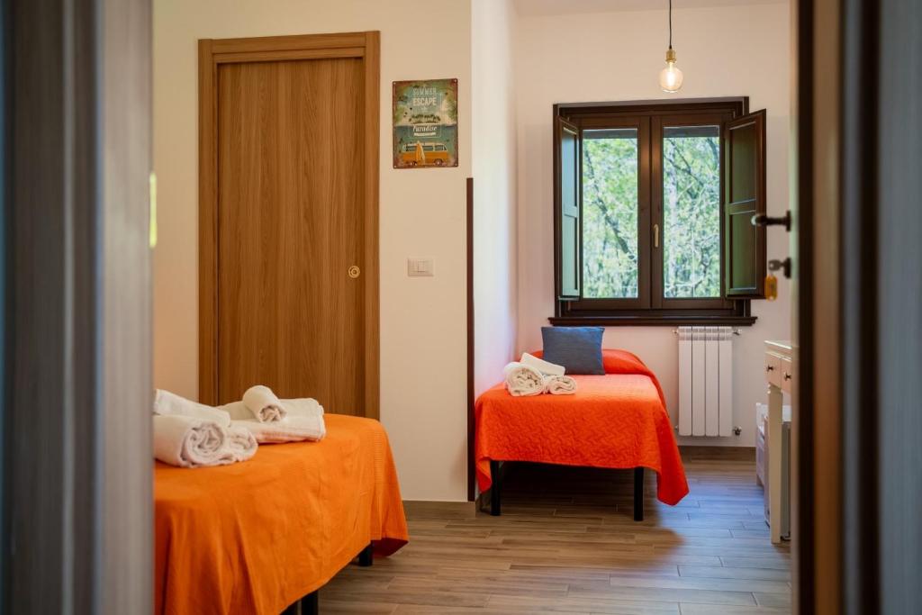 Postel nebo postele na pokoji v ubytování B&B La Timpa Del Cucco