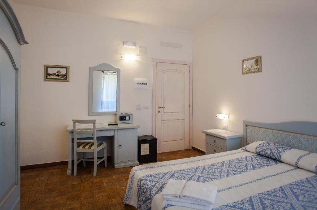 Postel nebo postele na pokoji v ubytování Hotel Sandalyon