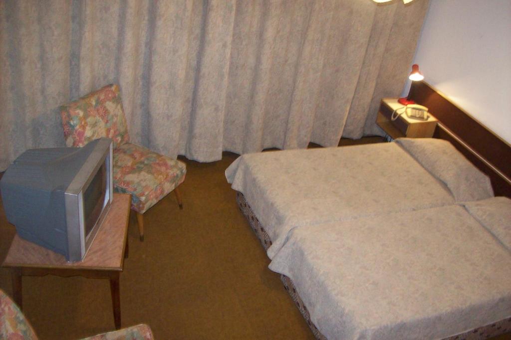 Postel nebo postele na pokoji v ubytování Rivoli Hotel Jerusalem