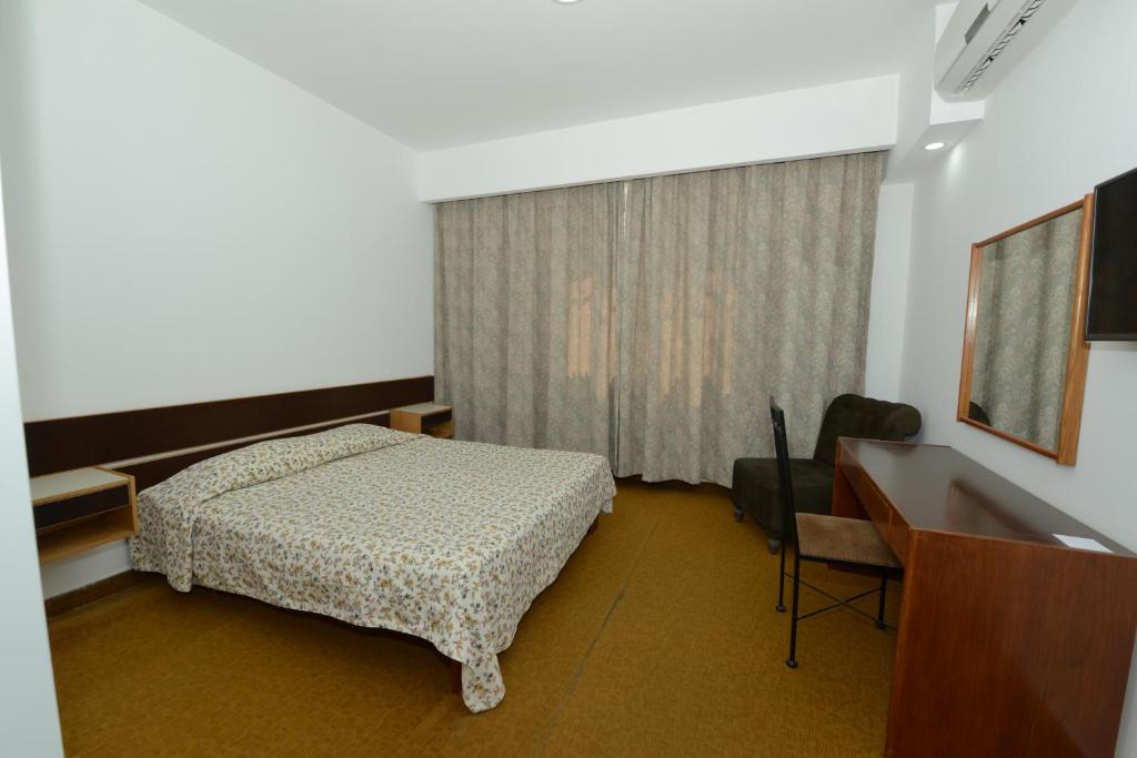 Postel nebo postele na pokoji v ubytování Rivoli Hotel Jerusalem