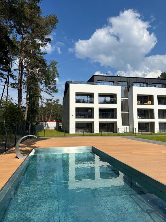 Bazén v ubytování Apartamenty Joy Me Łukęcin nebo v jeho okolí