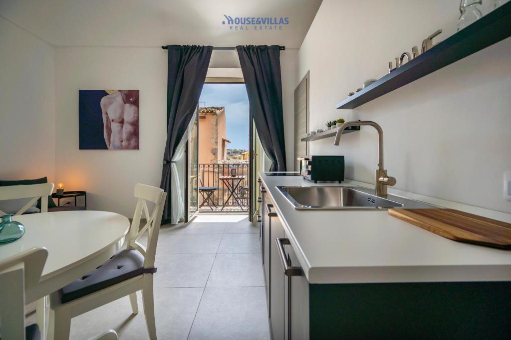 Postel nebo postele na pokoji v ubytování House & Villas - Demetra