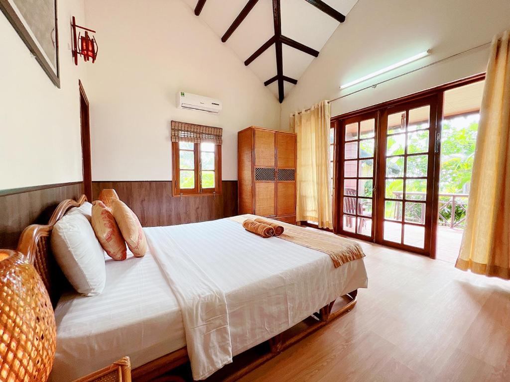 Giường trong phòng chung tại Little Muine Cottages Resort