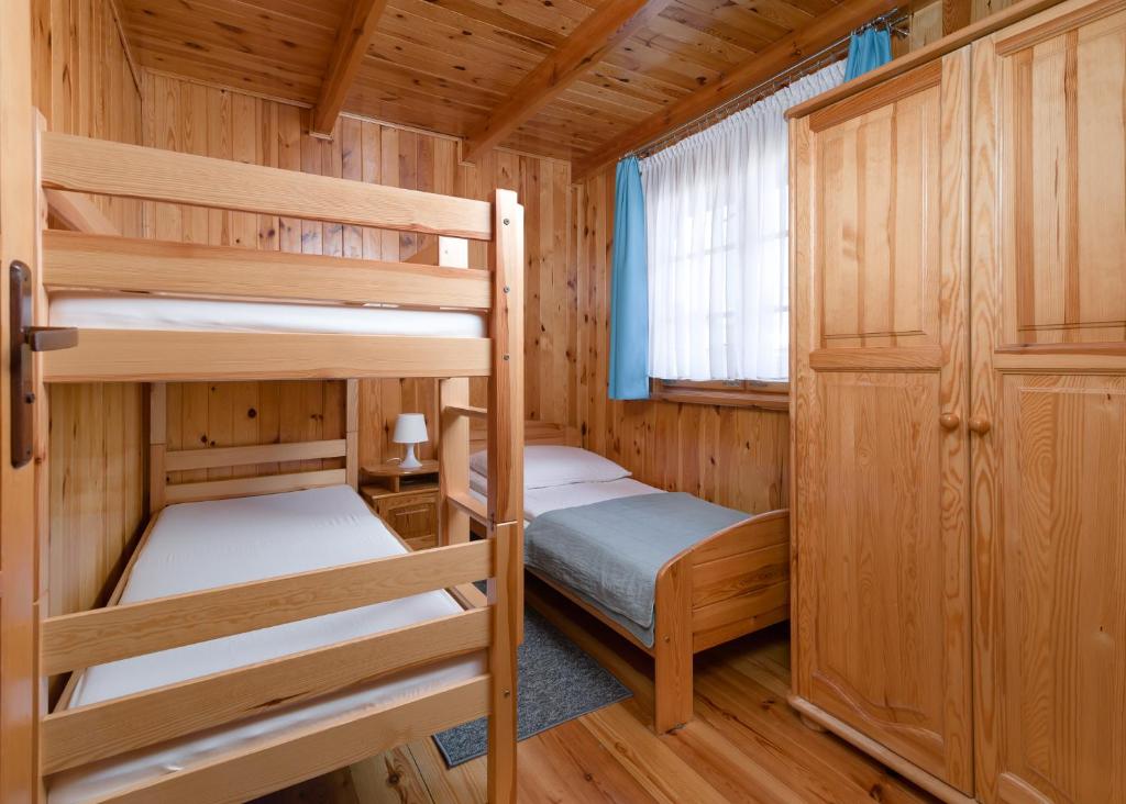 Postel nebo postele na pokoji v ubytování "Sevach" Domki Ustronie Morskie