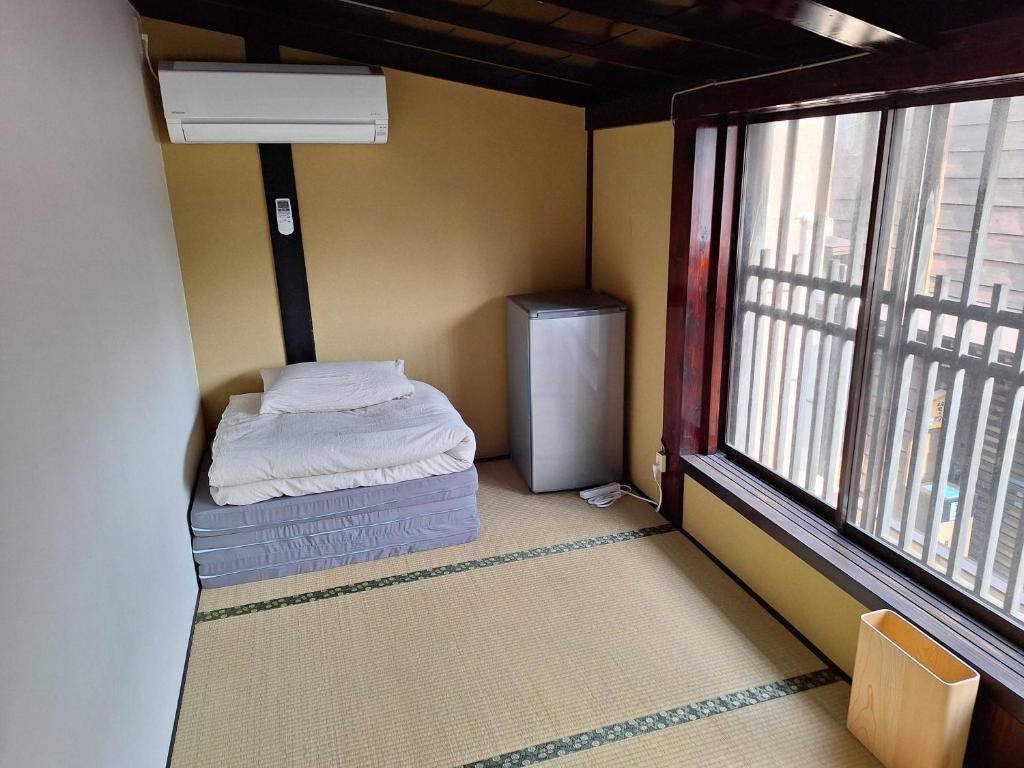 Postel nebo postele na pokoji v ubytování GLOCE sadoベースキャンプ宿根木
