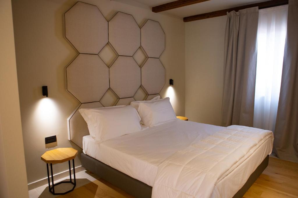Postel nebo postele na pokoji v ubytování WINE RESORT LE VIGNE AL CASTELLO