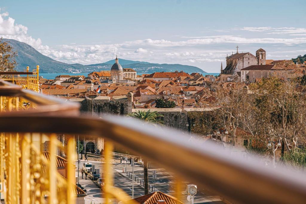 a view of a city from a balcony at Hilton Imperial Dubrovnik in Dubrovnik