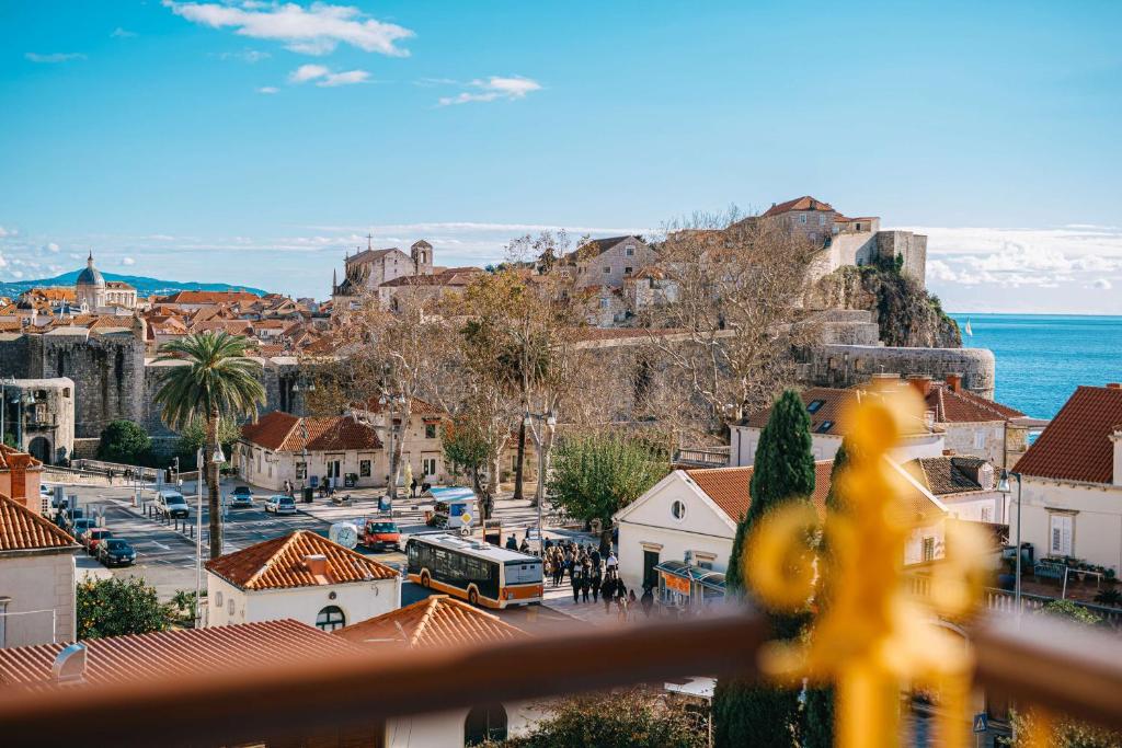 a view of a city with a bus on a street at Hilton Imperial Dubrovnik in Dubrovnik