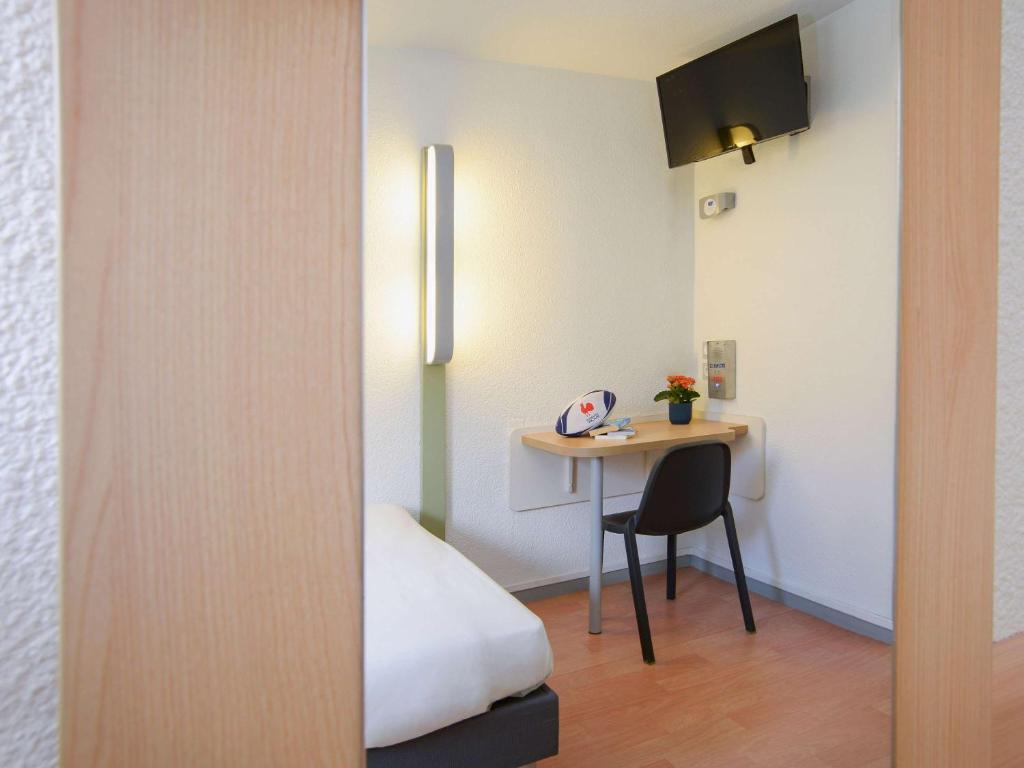 Postel nebo postele na pokoji v ubytování ibis budget Toulouse Centre Gare