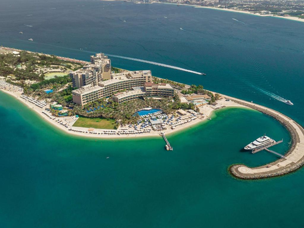 an aerial view of a resort on an island in the water at Rixos The Palm Hotel & Suites - Ultra All Inclusive in Dubai