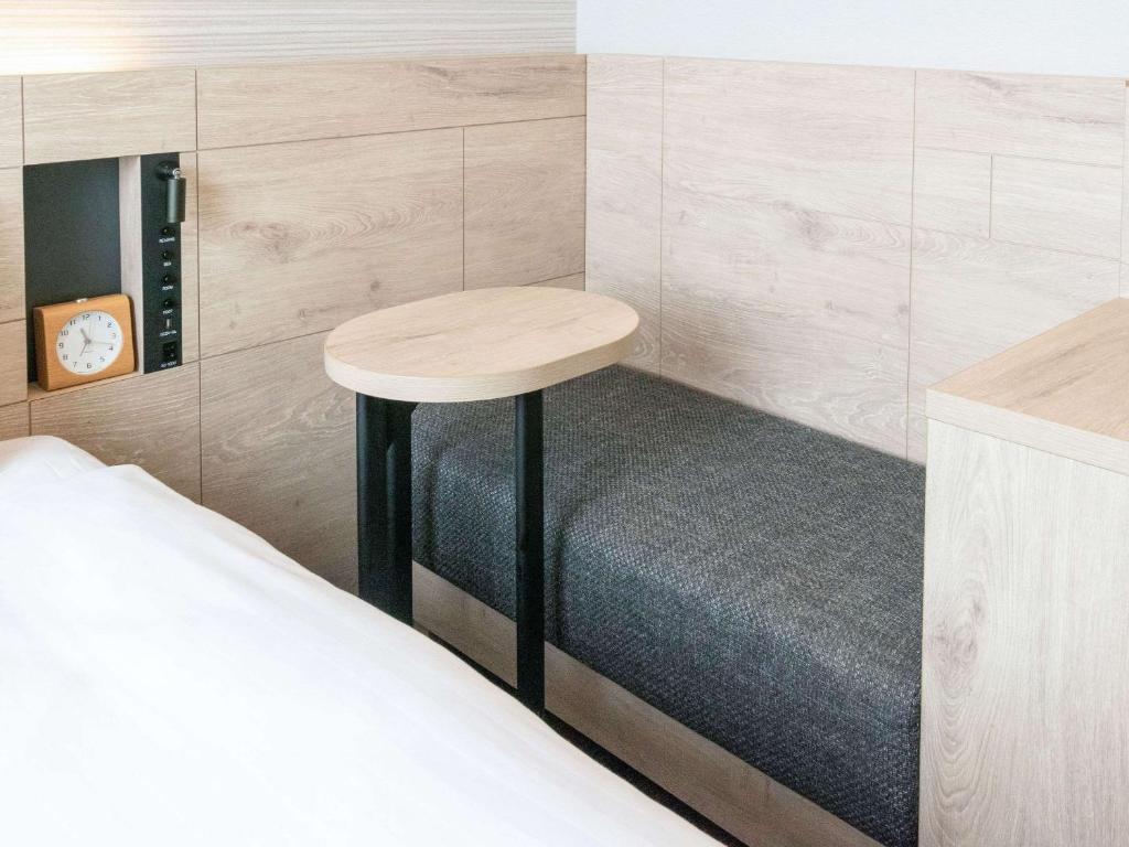 Postel nebo postele na pokoji v ubytování Comfort Hotel Nagoya Shinkansenguchi
