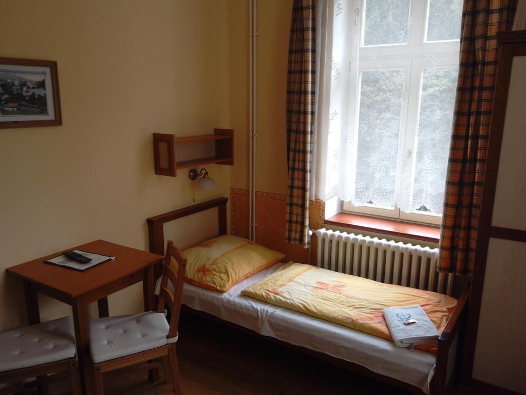 Postel nebo postele na pokoji v ubytování Marianum JL,s.r.o.