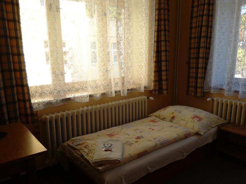 Postel nebo postele na pokoji v ubytování Marianum JL,s.r.o.
