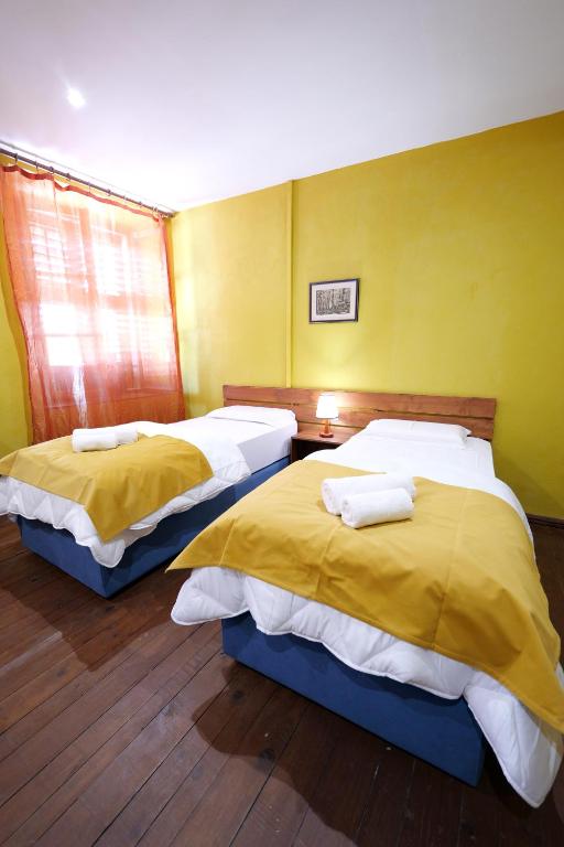 Postel nebo postele na pokoji v ubytování Guesthouse n'Odë