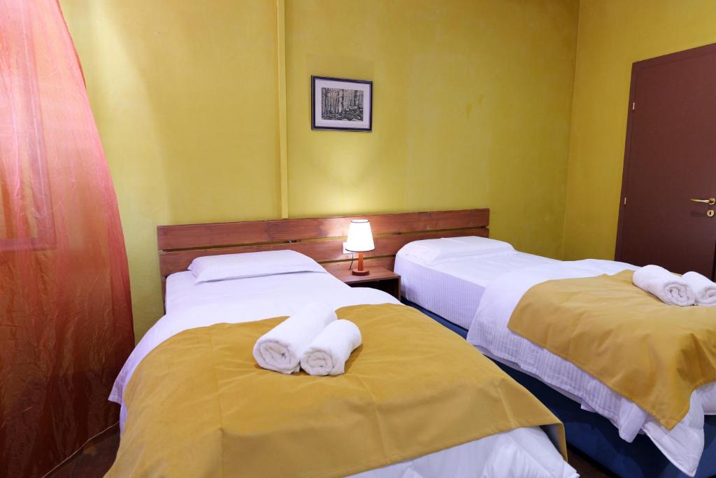Postel nebo postele na pokoji v ubytování Guesthouse n'Odë