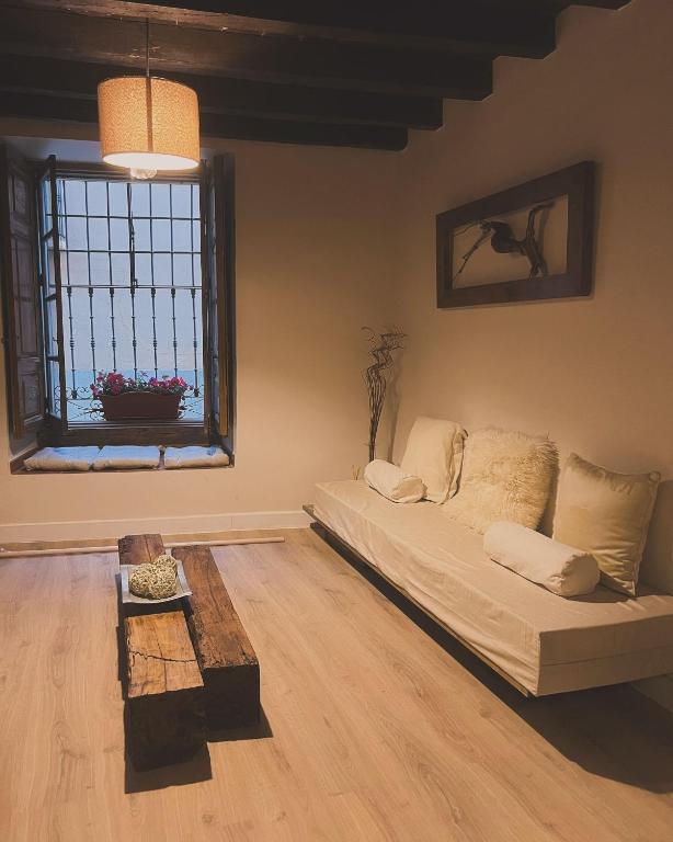 a living room with a couch and a window at Casa Nicola in Toro