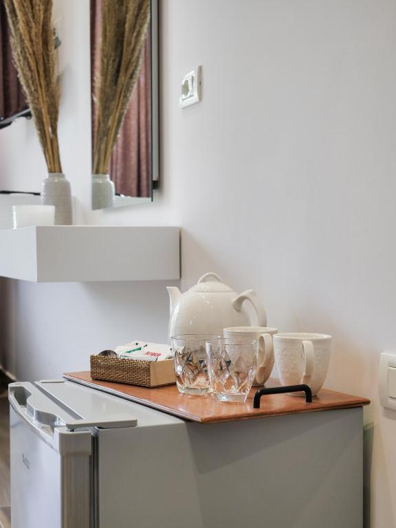 a kitchen counter with a tea pot and dishes on it at Villa Tonia in Himare