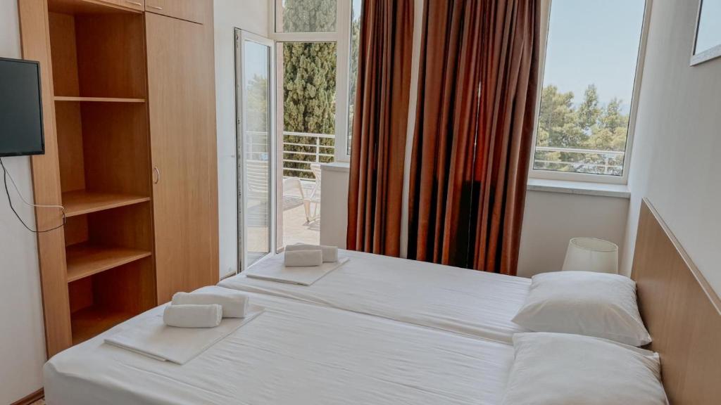 Postel nebo postele na pokoji v ubytování Motel Ljetni raj