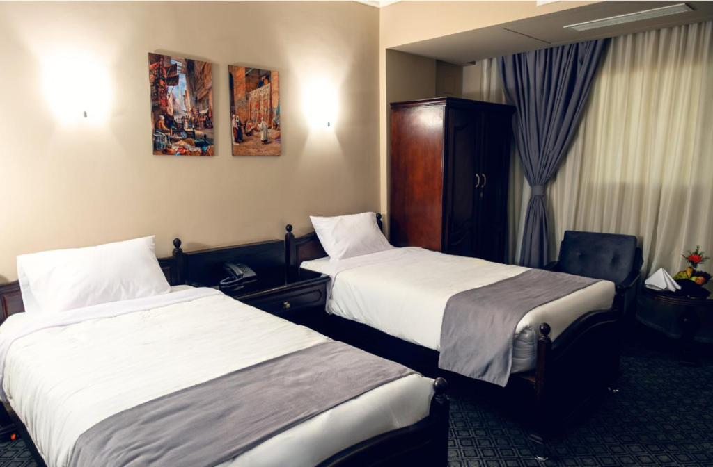 Postel nebo postele na pokoji v ubytování Marwa Palace Hotel Cairo