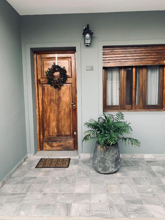 a front door with a potted plant in front of it at Casa Norte in Concordia