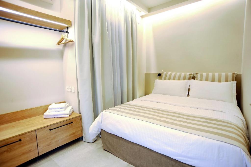 Postel nebo postele na pokoji v ubytování Demar Suites Vlycho Lefkada