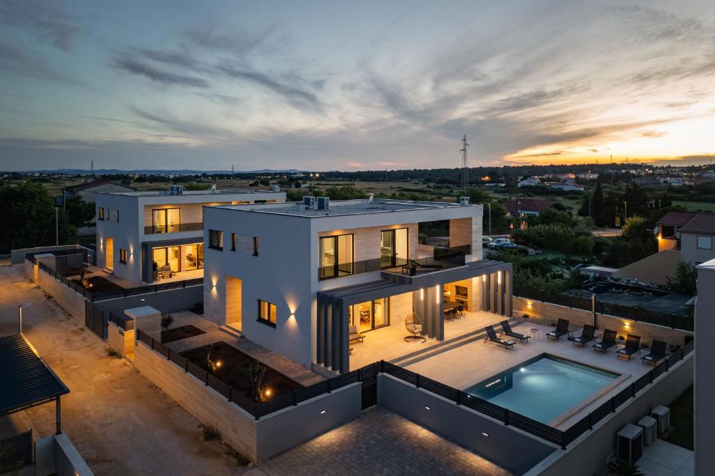 an aerial view of a house with a swimming pool at Villa Roko Nin ZadarVillas in Nin
