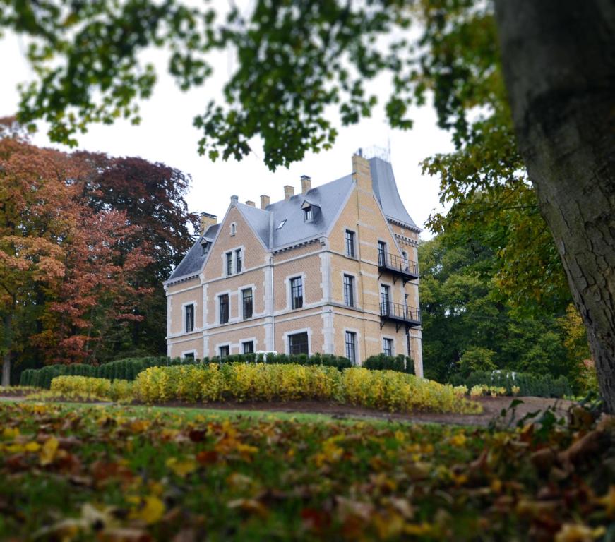 a large house in the middle of a park at Chateau Beausaint in La-Roche-en-Ardenne