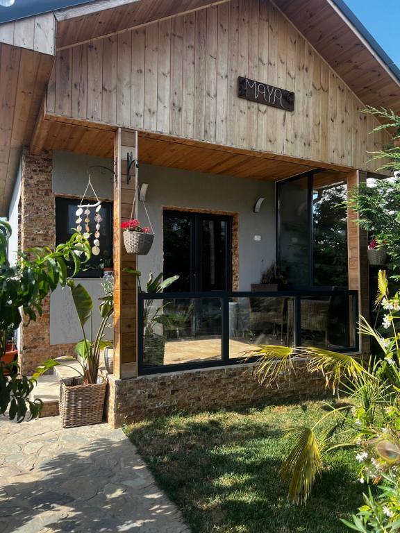 a building with a sign on the front of it at Cabana Maya in Corbu