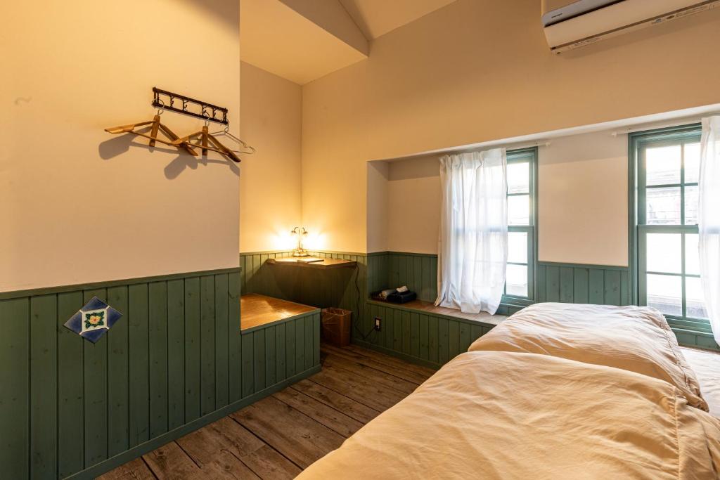 Postel nebo postele na pokoji v ubytování HoNoDo COBO
