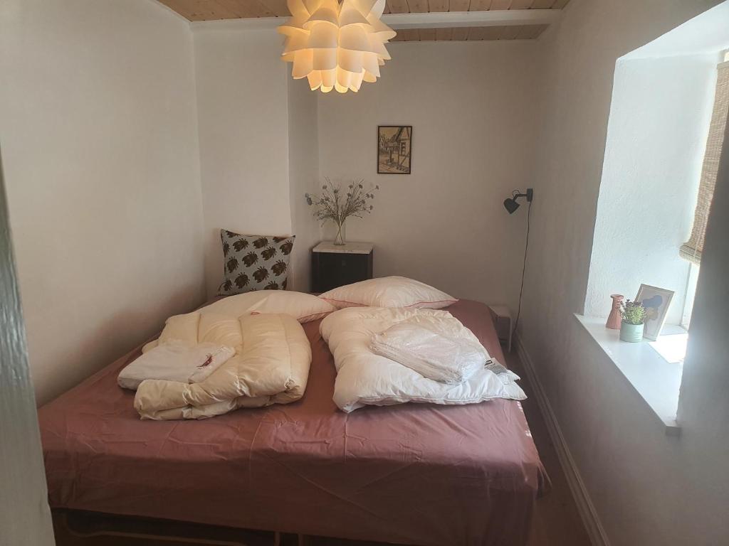 Postel nebo postele na pokoji v ubytování Slotsgaardens feriegård.