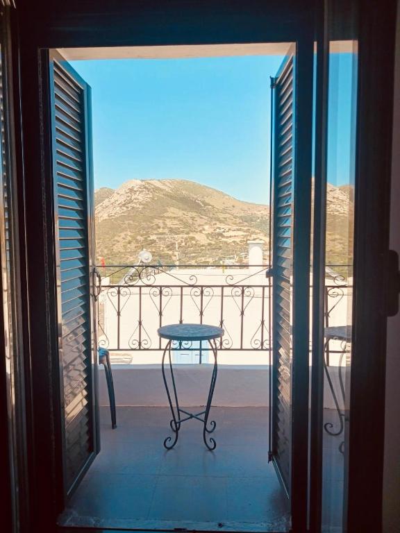 a view of a table from a balcony with a view at Amersa's House in Skiros