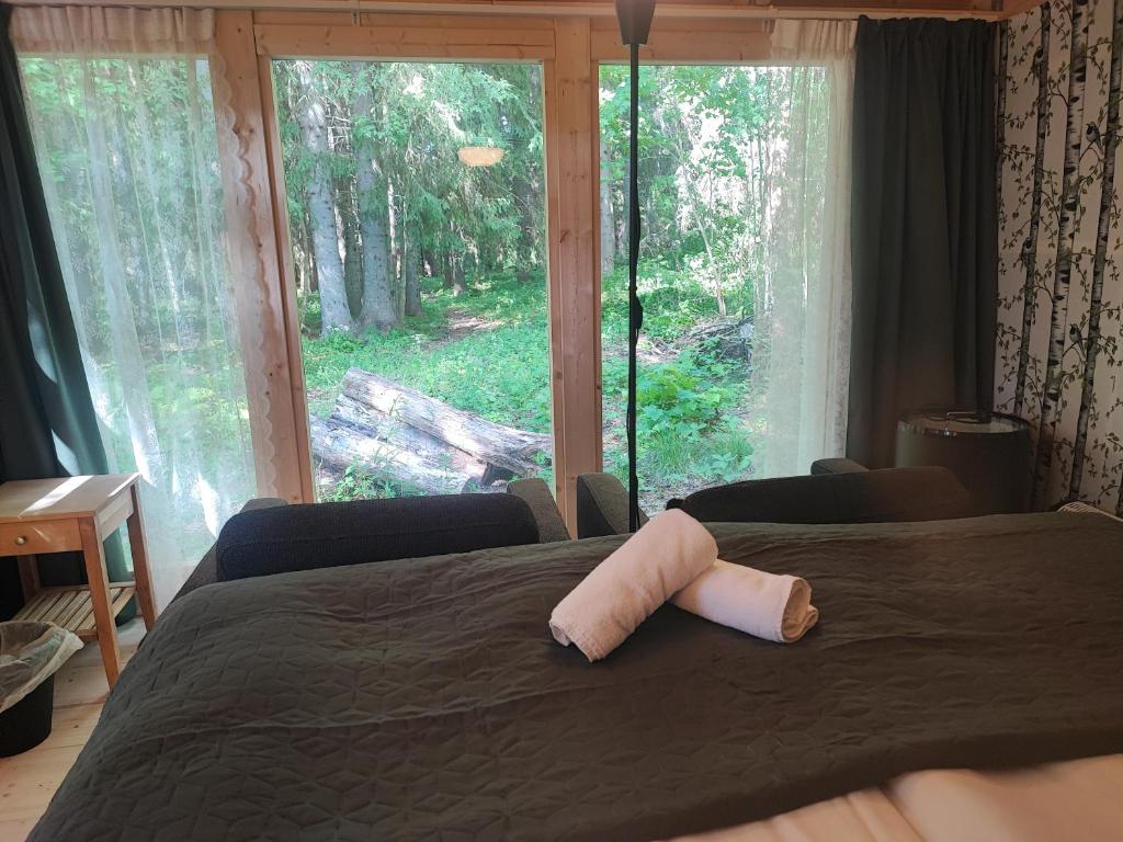 Postel nebo postele na pokoji v ubytování Sjugare Gård Glamping