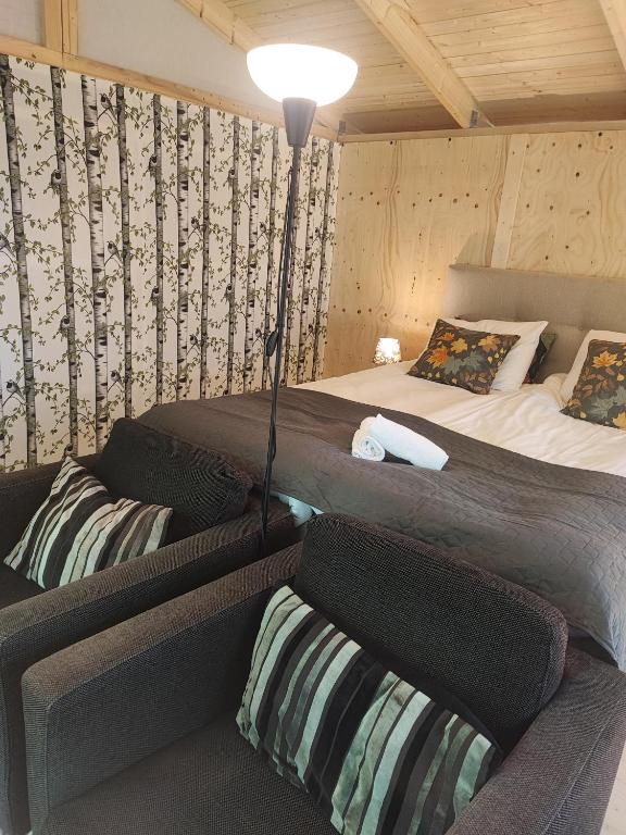 Postel nebo postele na pokoji v ubytování Sjugare Gård Glamping