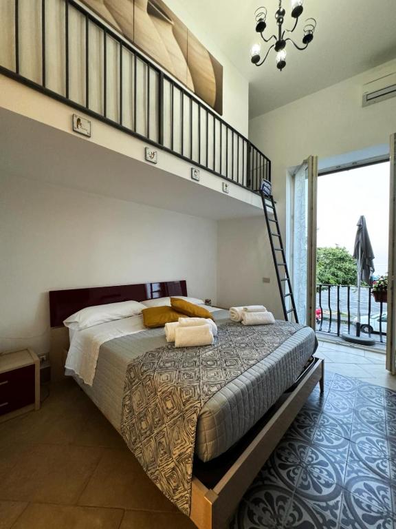 a bedroom with a large bed with a loft at Casa MiLù in Canneto