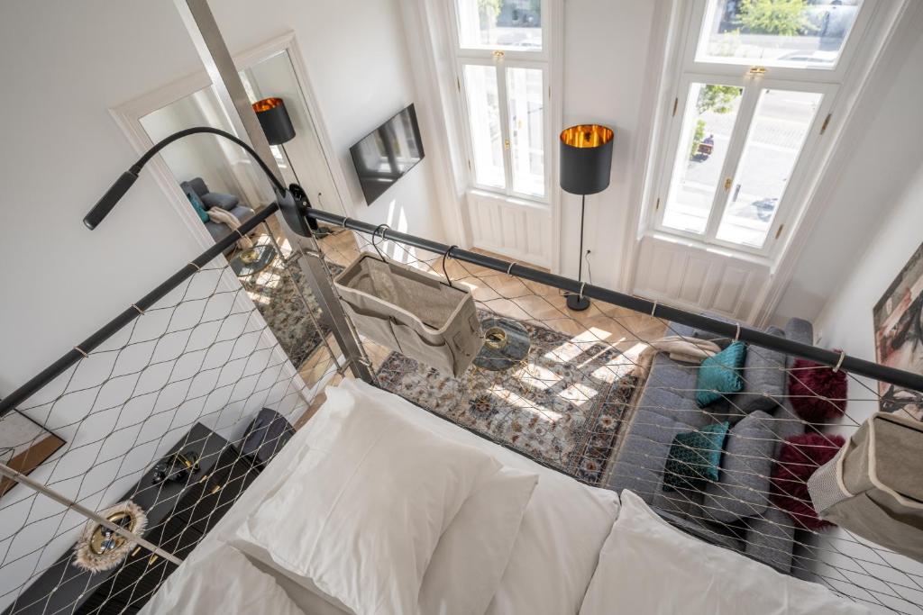 Postel nebo postele na pokoji v ubytování V62 studio apartments- Downtown Sopron